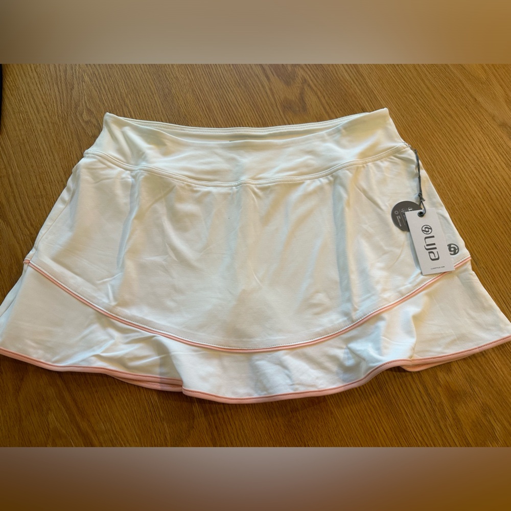 NWT Lija white tennis skirt with pink piping. Size L